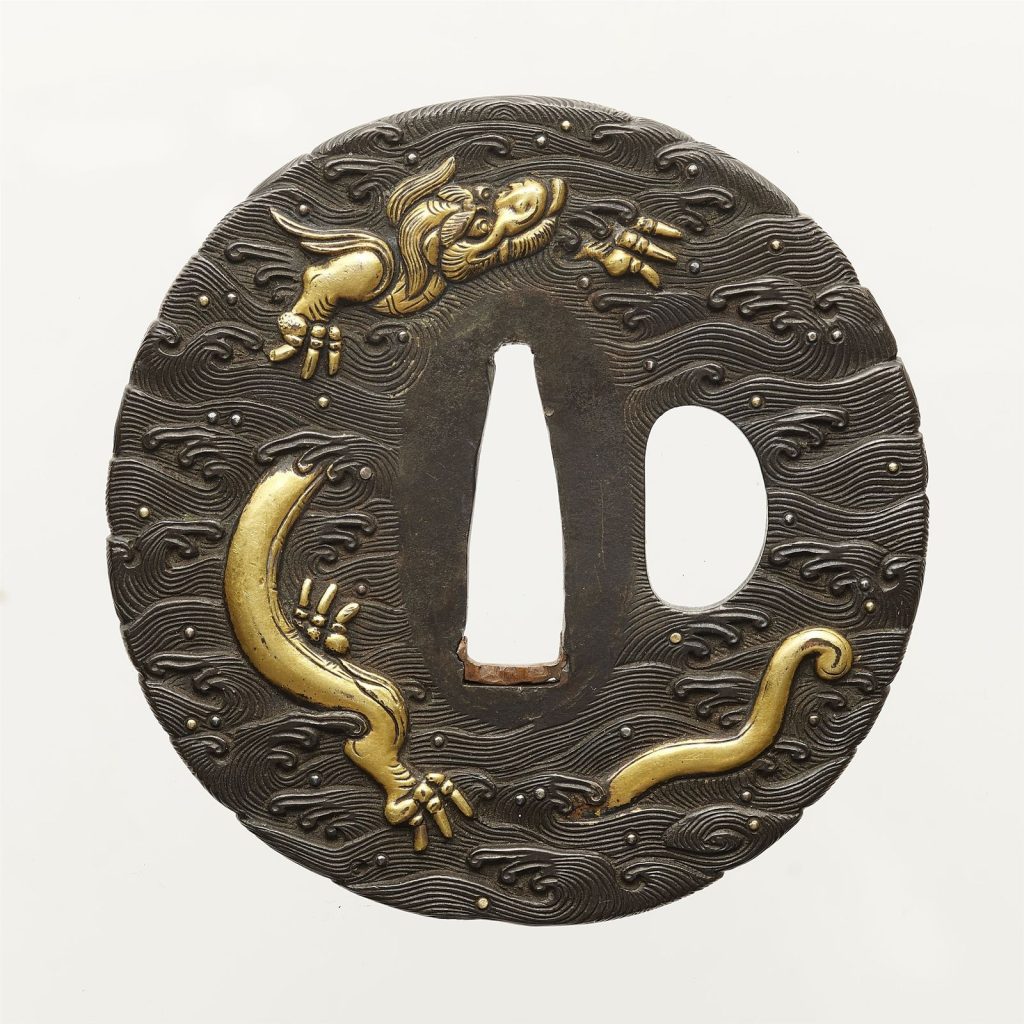 The other face: a longer gold dragon curving through the waves around the central opening.